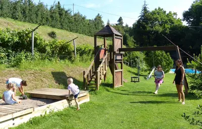 a group of people playing in a playground at Residence Liesy in Tesimo