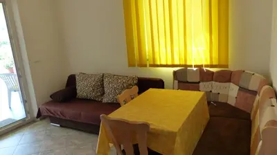 a living room with a table and a couch at Residence Liesy in Tesimo