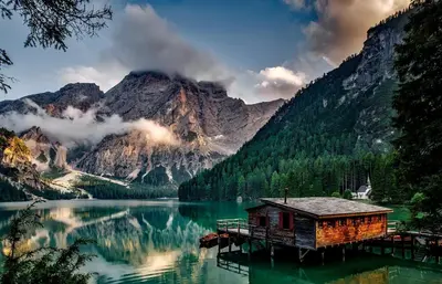 a cabin on a dock in the middle of a lake at City Café - CENTRAL Apartment in Brunico