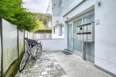 a bike parked on a sidewalk next to a building at City Café - CENTRAL Apartment in Brunico
