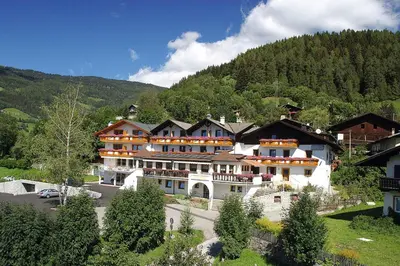 a large building in the middle of a mountain at Hotel Sonnenheim in Vipiteno