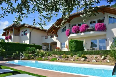 a house with a swimming pool in front of it at Gutshof Sinn in Caldaro