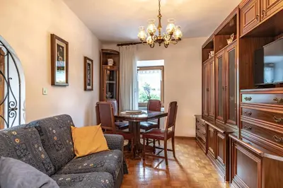a living room with a couch and a table at Dimora Franch Cloz Ospitar in Cloz