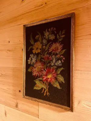 a picture of a painting of flowers on a wall at Braunegg 1 in Brunico