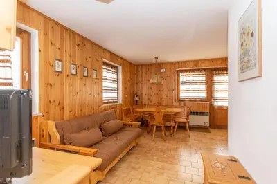 a living room with a couch and a table at Casa Coli in Mazzin