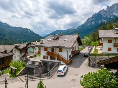 a car parked in a parking lot in a village at Casa Coli in Mazzin