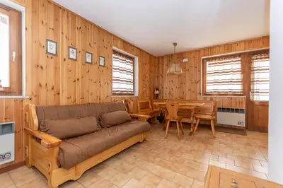 a living room with a couch and a table at Casa Coli in Mazzin