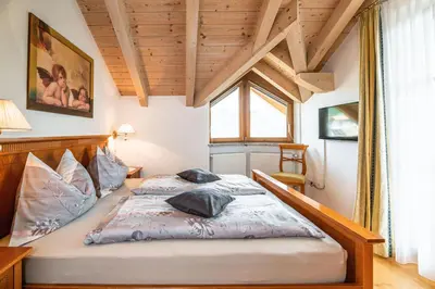 a bedroom with a large bed in a room at Huebenburg in Appiano sulla Strada del Vino