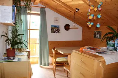 a kitchen with a table and a dining room at Verleierhof in Castelrotto