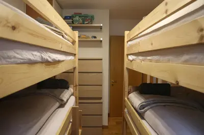 two bunk beds in a small room at Italian Apartment with Hot Tub in Arabba