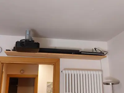 a camera on a shelf in a room at Italian Apartment with Hot Tub in Arabba
