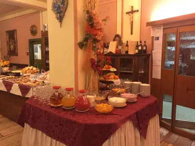 a table with a buffet of food on it at Hotel Alle Alpi in Alleghe