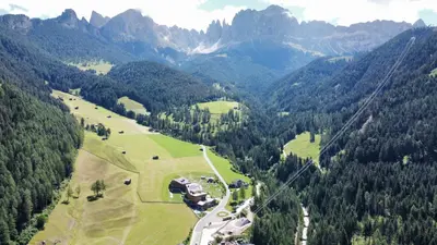an aerial view of a valley with mountains and trees at Schneiderhaus in Bagni di Lavina Bianca