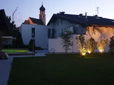 a house with christmas lights in the yard at Residence Baumgartner in Fiè