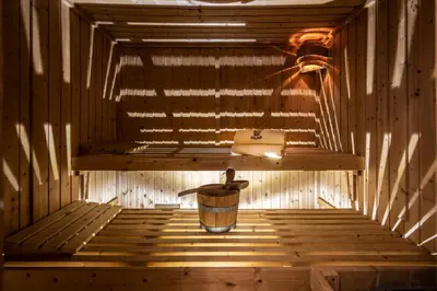 a inside of a sauna with a bucket in it at Appartements Panorama in Fiè