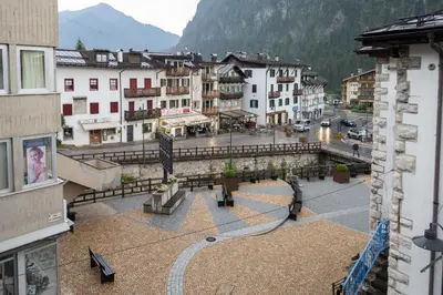 a view of a town with buildings and a street at Cesa Molin in Campitello di Fassa