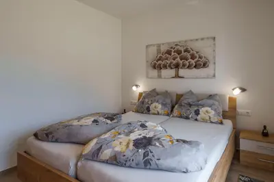 a bedroom with two beds with pillows on them at Residence Weinberg 8 in Nalles