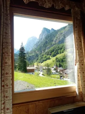a window with a view of a mountain at Il nido (Cica) in Sottoguda
