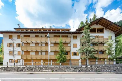 a building on the side of a road at Cesa Monti pallidi 1 in Canazei