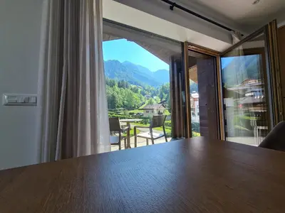 a dining room table with a view of a mountain at Chalet Gravina in Ortisei