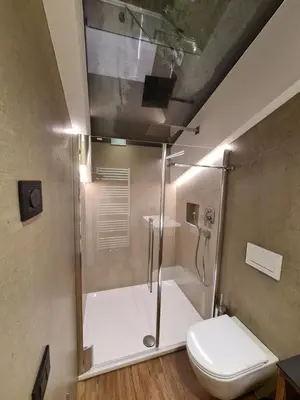 a bathroom with a shower and a toilet at Chalet Gravina in Ortisei