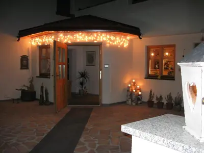 a living room with christmas lights on the wall at Messnerwirt Onach in San Lorenzo di Sebato
