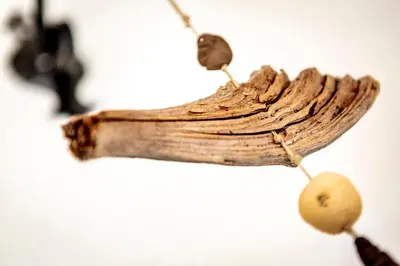 a piece of drift wood on a necklace at Valle Filippo in Canazei
