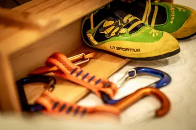 a pair of shoes and a pair of glasses on a table at Valle Maura in Canazei