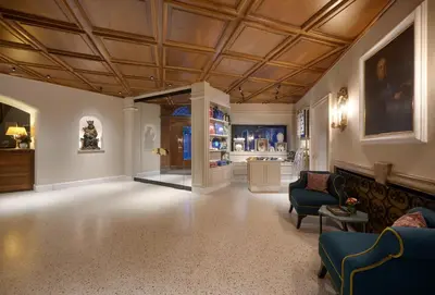 a living room with a coffered ceiling and a couch at Hotel Elephant in Bressanone
