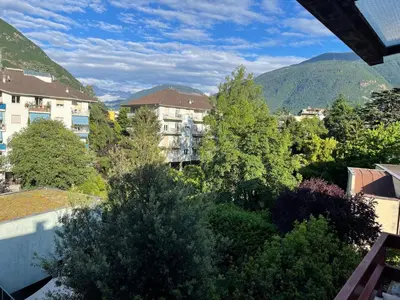 a view of a city with buildings and trees at LaCasadiGuendy in Bolzano