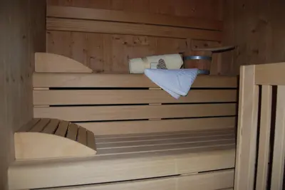 a wooden sauna with a towel and a towel at Residence Ciasa Alpe in Vigo di Fassa