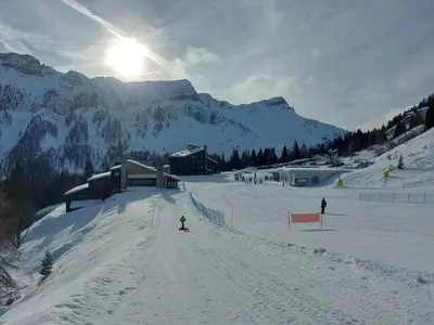 a person skiing down a snow covered ski slope at Casa Cortina - presso Sussy Residence in Falcade