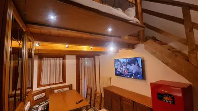 an overhead view of a bedroom in a house at La Casa Degli Orsi - presso Sussy Residence in Falcade