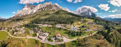 an aerial view of a village in the mountains at Locanda Montana in San Vito di Cadore