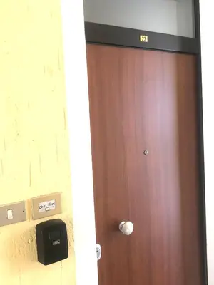 a brown door with a tv on top of it at chez Chany in Merano