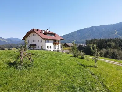 a house on a hill in a green field at Moarberg in Brunico