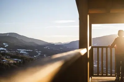 a person standing on a skateboard on a balcony at Hotel Fernblick in Bressanone