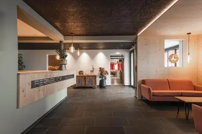 a lobby with a waiting room with a couch at Hotel Fernblick in Bressanone