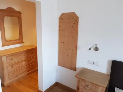 a white bathroom with a sink and a window at Hotel Fernblick in Bressanone