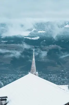 a snow covered hill with trees in the background at Hotel Fernblick in Bressanone