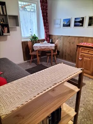 a living room with a table and a table sidx sidx sidx at I girasoli in Sanzeno