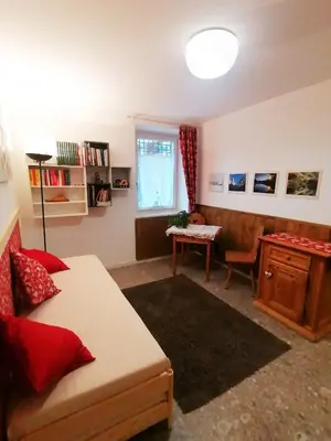 a living room with a couch and a table at I girasoli in Sanzeno