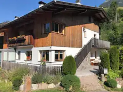 a large house with a fence in front of it at Haus Helga in Tires