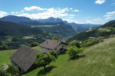 a living room with a couch and a table at HAUSERHOF Chalet with Dolomite View in Villandro