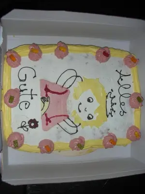 a cake with a hello kitty on top of it at Gasthaus St. Valentin in Chiusa