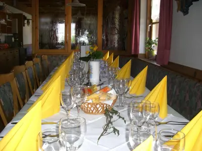 a long table with wine glasses on it at Gasthaus St. Valentin in Chiusa