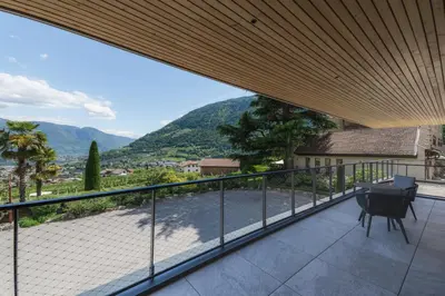a balcony with a view of a mountain at Schloss Plars wine & suites in Lagundo