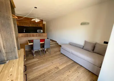 a living room with a couch and a table at Casa Fabiolin in Daiano