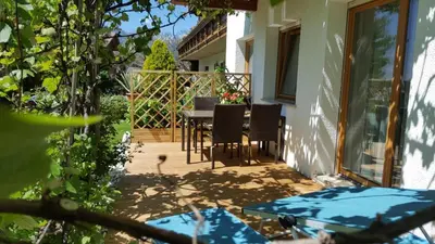 a patio with a table and chairs on a balcony at Residence Klementhof 2 in Fiumes
