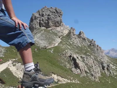 a person sitting on top of a mountain at Residence Klementhof - A 208 3 in Fiumes